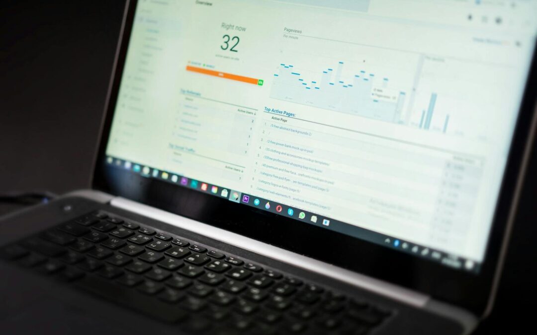 A laptop displaying an analytics dashboard with real-time data tracking and analysis tools.
